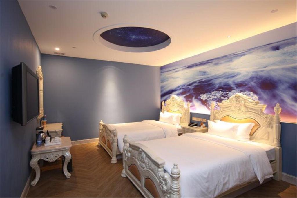 Postel nebo postele na pokoji v ubytování Nan Yang Royal Hotel