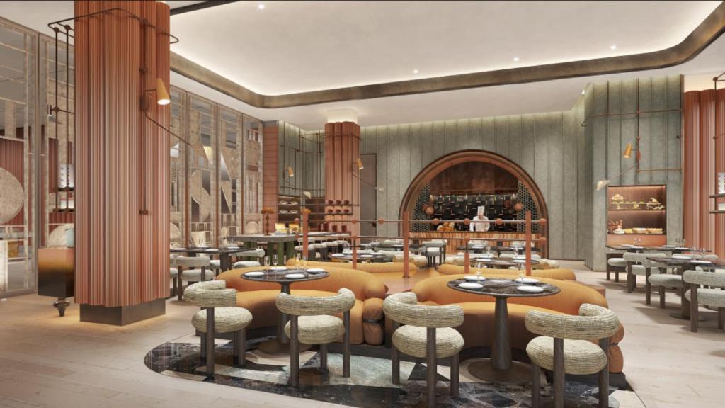 a restaurant with tables and chairs in a room at Hotel Indigo Xi'an High-tech Zone by IHG in Xi'an