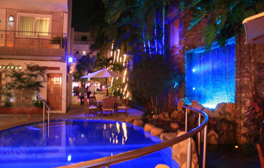 Bazén v ubytování Hotel Rio Malecon nebo v jeho okolí