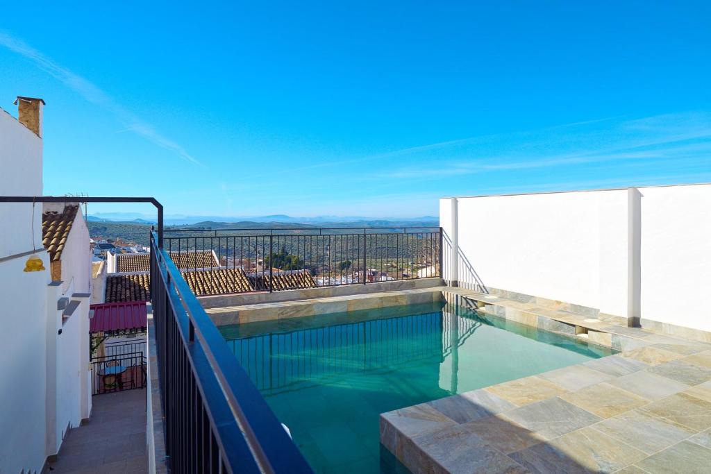 a swimming pool on the balcony of a building at Casa Romo 2 in Rute