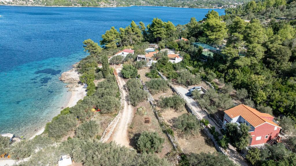 an aerial view of a house on an island in the water at Apartman Roza 1 by Villas Guide in Vela Luka