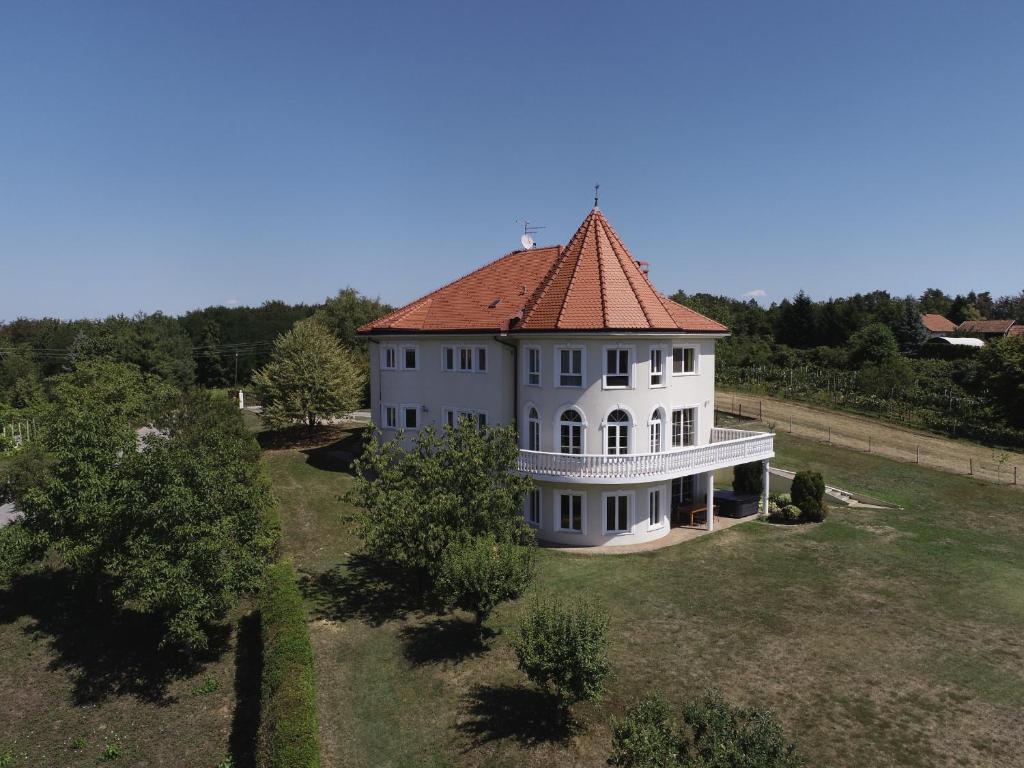 an aerial view of a large white house with a red roof at Kuća za odmor Sunce in Kraljev Vrh