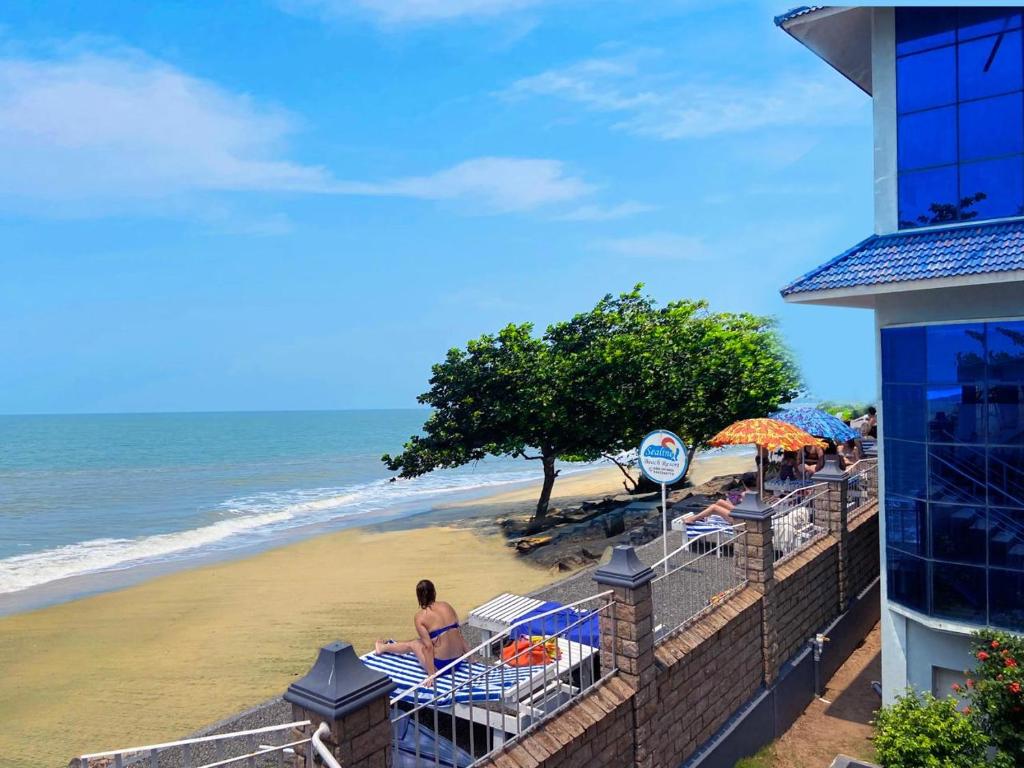 a view of the beach from the balcony of a hotel at Sealine Beach Resorts in Cherai Beach