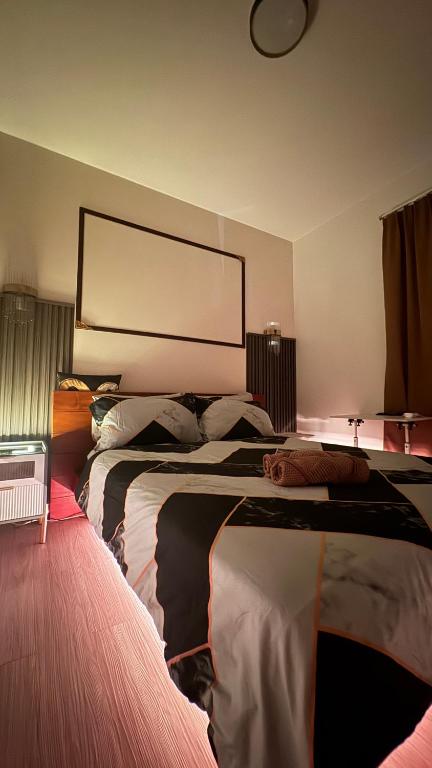 a hotel room with two beds and a large window at Mon Amour Haven - 1BR Taytay Rizal in Taytay