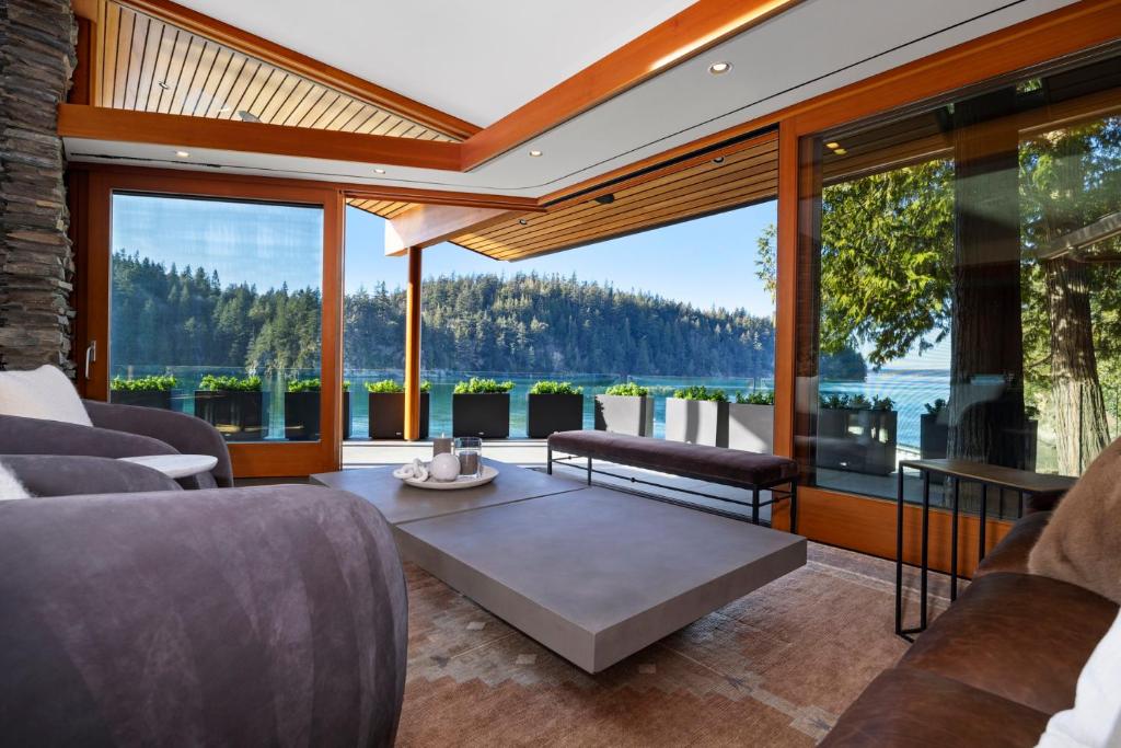 a living room with a view of the water at Chuckanut Point Villa 2 Bedroom in Bellingham