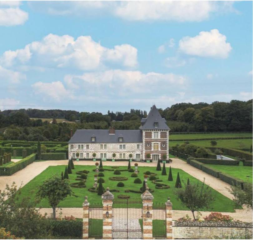 a large house with a large garden in front of it at Domaine du Bosc Roger in Bouquetot