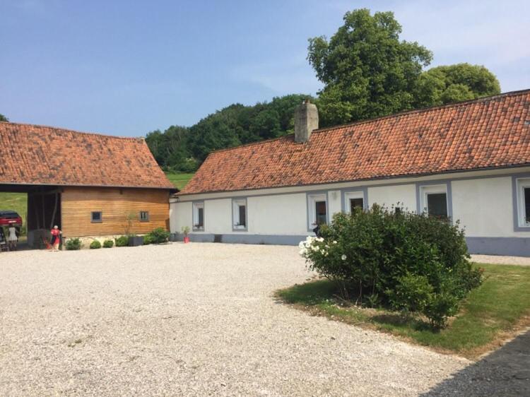 a group of buildings with a large gravel driveway at Longère 6-8 personnes - L'Ecrin Vert in Loison-sur-Créquoise