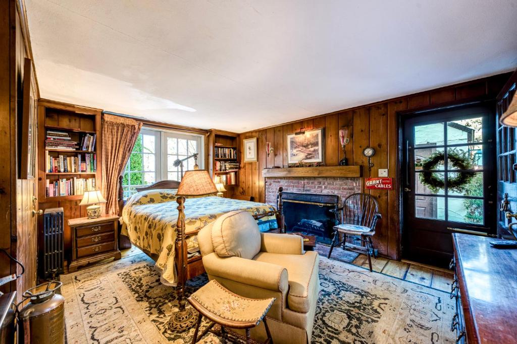 a bedroom with a bed and a fireplace at Highland Ave in Norwalk