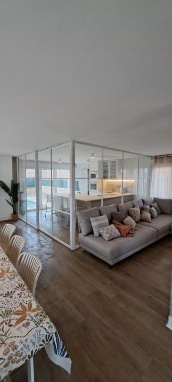 a living room with a couch and a table at EBEIA Casas Rurales IBEAS DE JUARROS (BURGOS) in Ibeas de Juarros