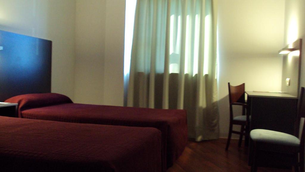 Postel nebo postele na pokoji v ubytování Hotel Alfinden