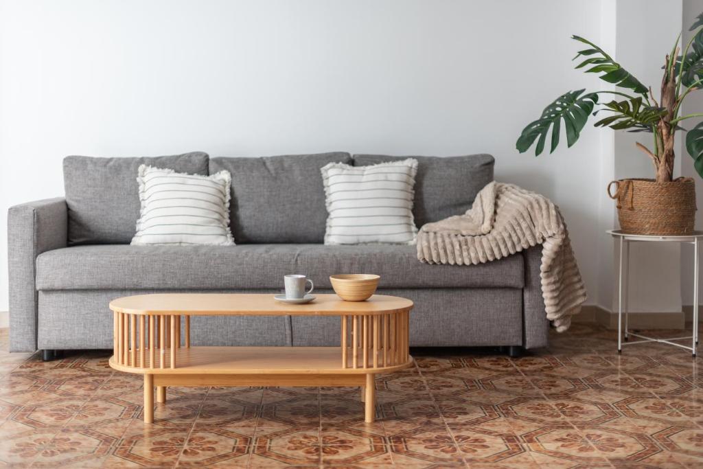 a living room with a couch and a coffee table at Les Villetes in Moncófar