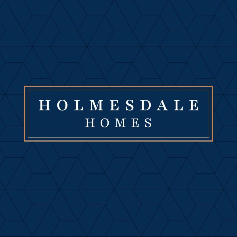 a blue house with a sign that reads luxurious homes at Barnwell by Holmesdale Homes in Kettering