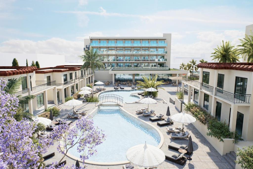 an aerial view of a hotel with a swimming pool at Sun Palace Protaras Waterpark Resort in Protaras