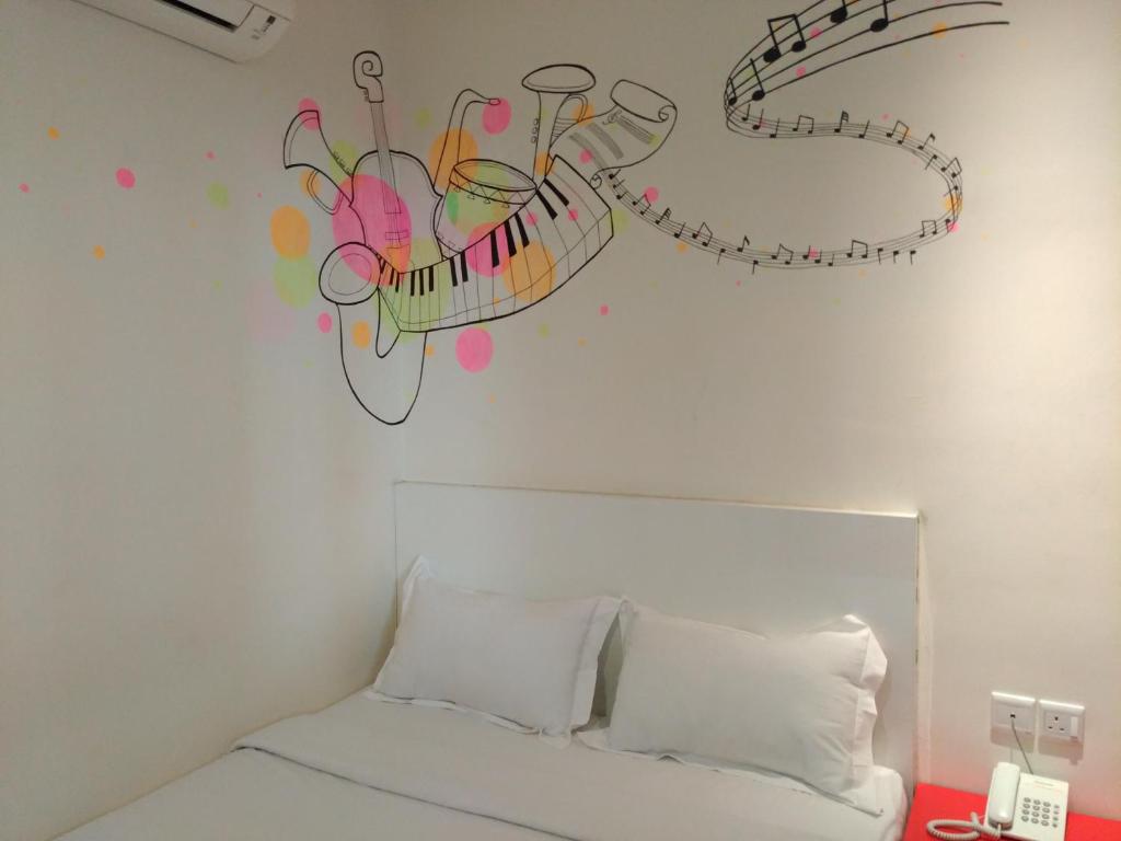 Postel nebo postele na pokoji v ubytování Hotel Strawberry Fields