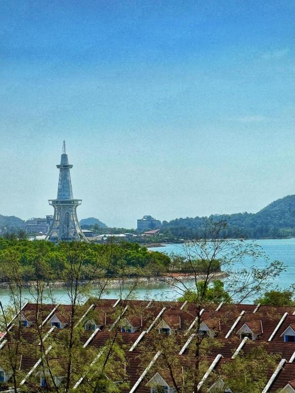 a view of the eiffel tower from the roofs of houses at Roamia Retreat - Lighthouse in Langkawi Islands