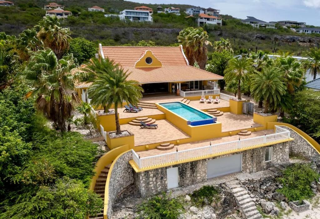 an aerial view of a house with a swimming pool at Villa Kas ku Playa 55 - Coral Estate in Willibrordus