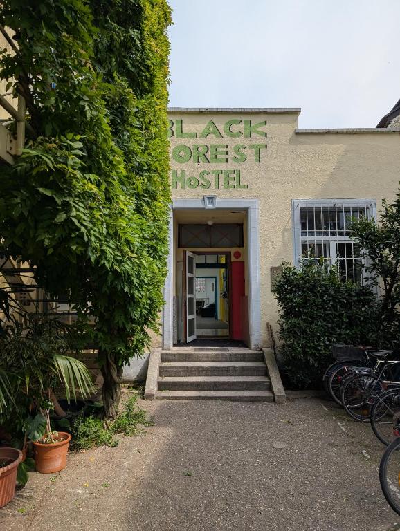 a building with the front door of a largest trust hospital at Black Forest Hostel in Freiburg im Breisgau