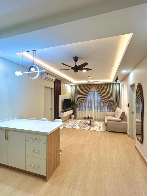 a living room with a ceiling fan and a couch at Julia HavenStay, Sepang KLIA in Sepang