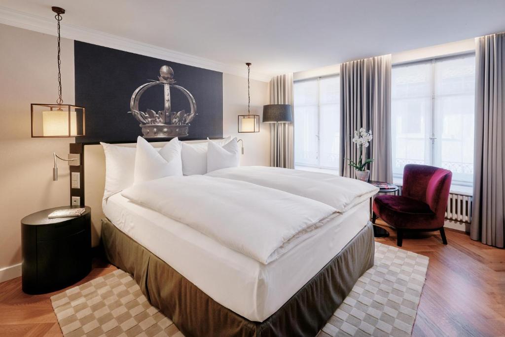 Un pat sau paturi într-o cameră la Sorell Boutique-Hotel Krone Winterthur