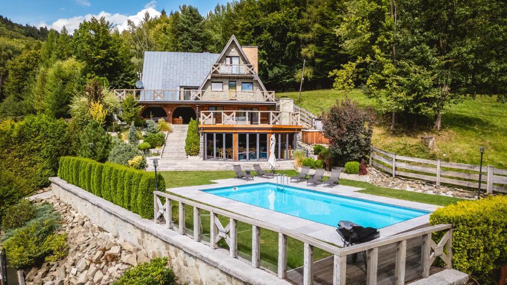 an aerial view of a house with a swimming pool at Dom Beskidy in Brenna