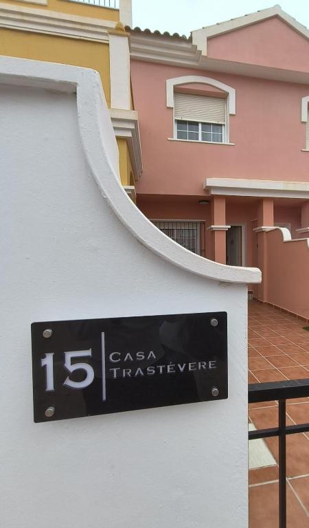 a sign on the side of a building at Casa Trastévere in San Juan de los Terreros