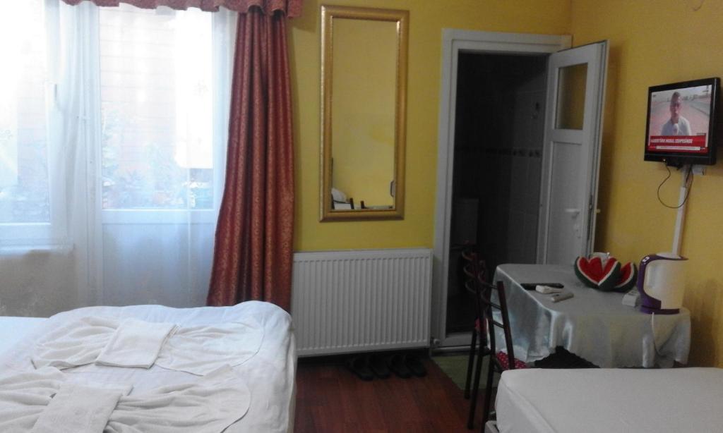 Postel nebo postele na pokoji v ubytování Bereket traveler Hotel