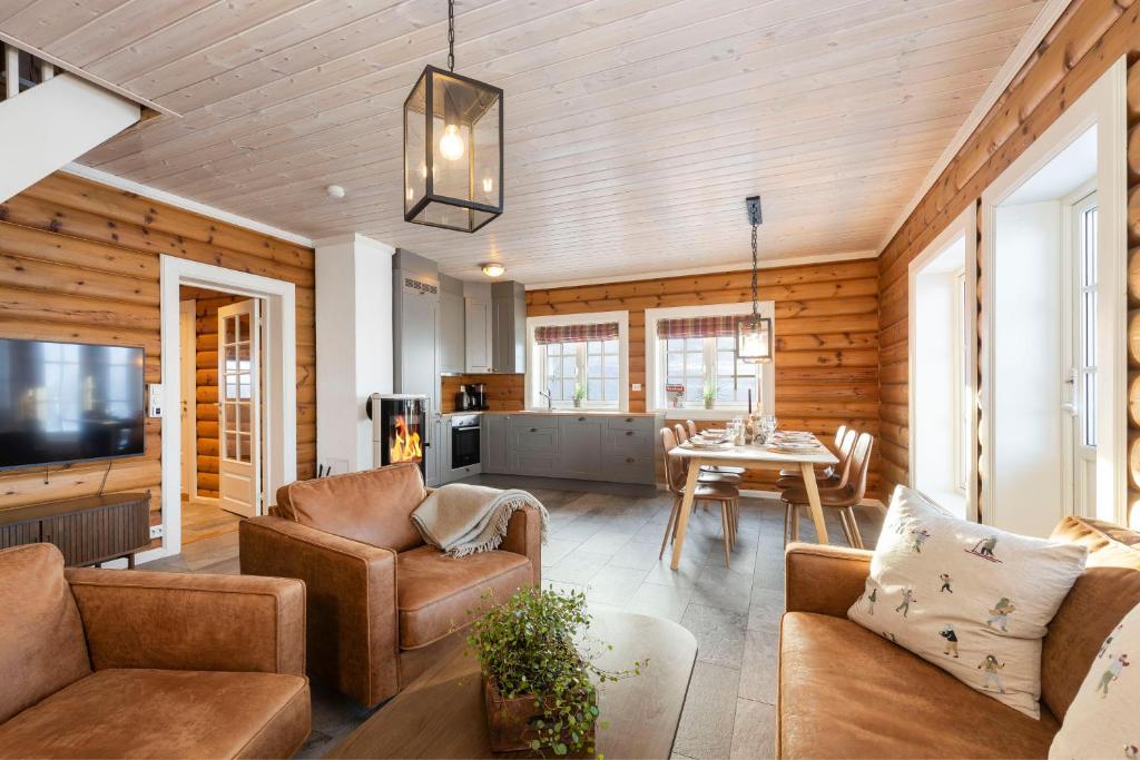 a living room with a couch and a table at Rauland Feriesenter in Rauland