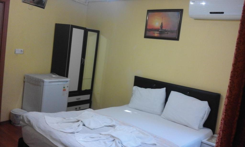Postel nebo postele na pokoji v ubytování Bereket traveler Hotel