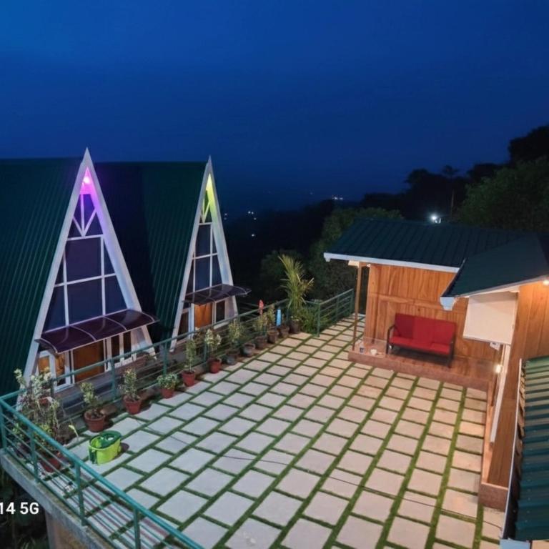 a house with a lit up roof at night at Paradise Meadows in Vagamon