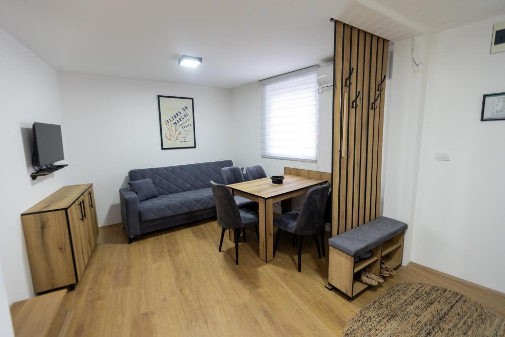 a living room with a couch and a table at Bakina kuca in Pirot