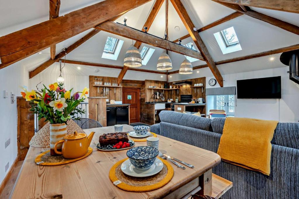 a kitchen and living room with a wooden table at 1 Bed in Werrington oc-c29073 in Werrington