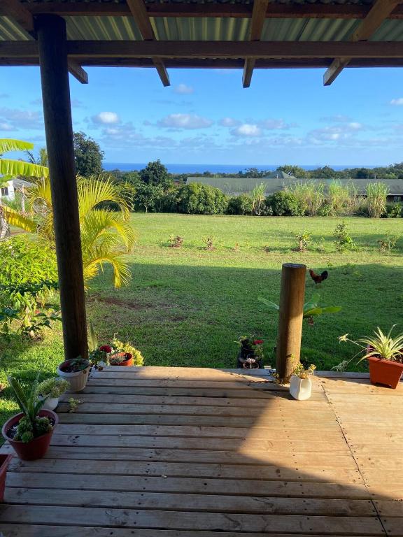 a porch with a view of a field at Studio Sunset Rapa Nui in Hanga Roa