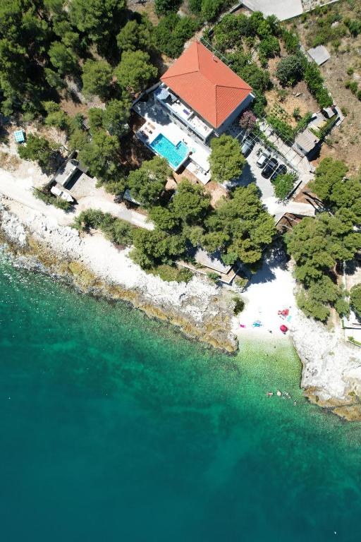 an aerial view of an island in the water at Villa Rosea in Slatine