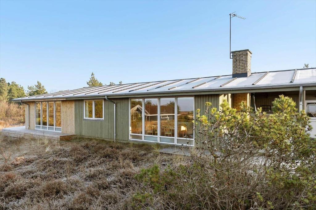 a green house with a solarium on top of it at 0186-Romo-Egedesminde-3 in Høm