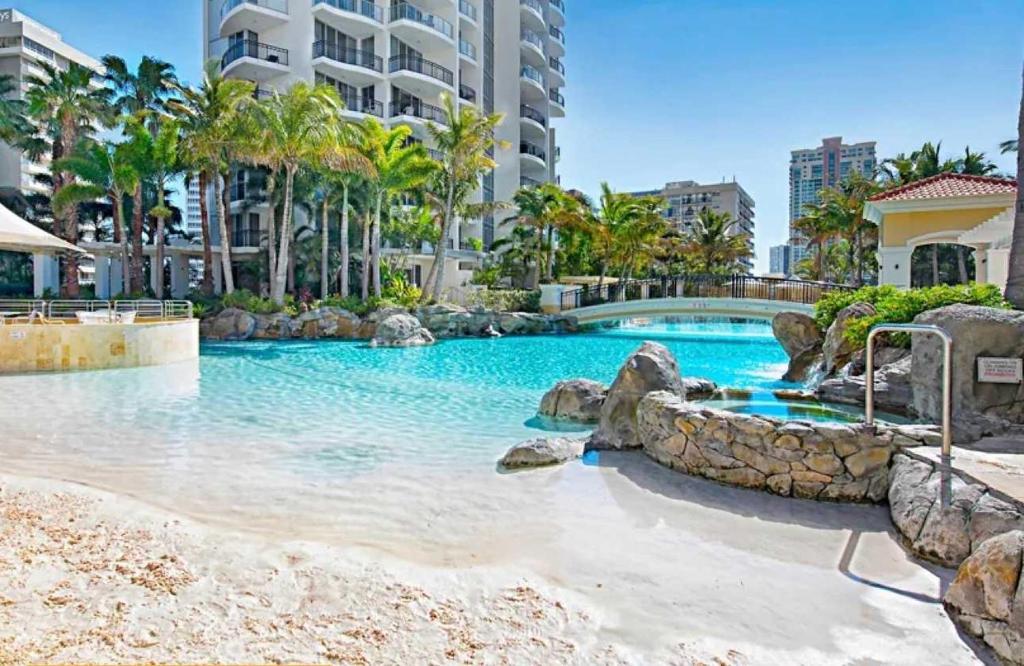 a swimming pool in the middle of a resort at L17 Small Studio Suite 2 Beds Pool Spa in Gold Coast