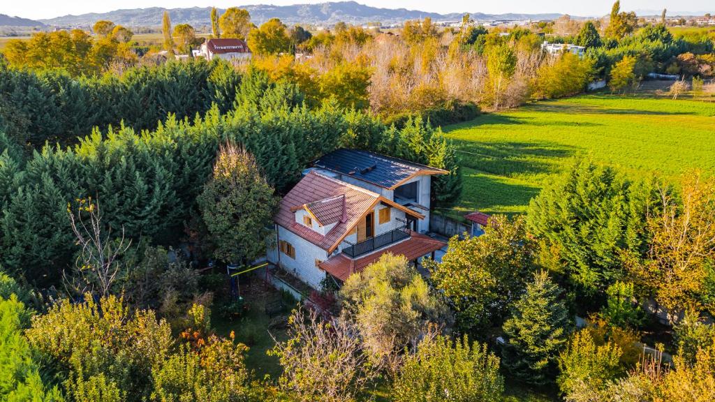 an aerial view of a house in a field at Ferma Gold by PikHost in Tirana