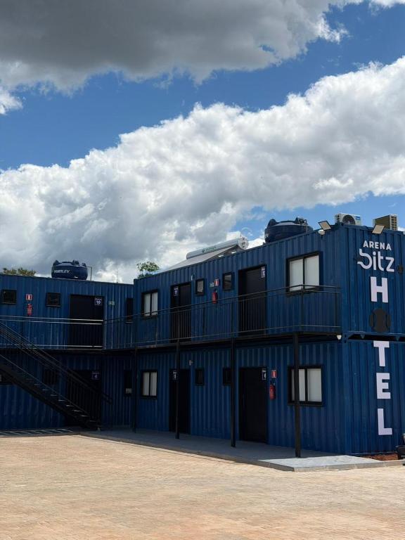 a blue building with windows on the side of it at Arena Bitz in Pato Branco
