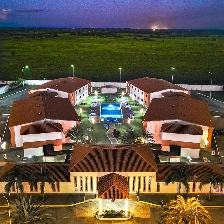 an overhead view of a building with a parking lot at Hotel Kariña Punta de Mata in Punta de Mata