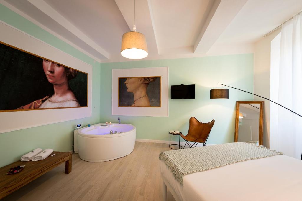 a bedroom with a bed and a bath tub in it at Apartment Perugia in Perugia