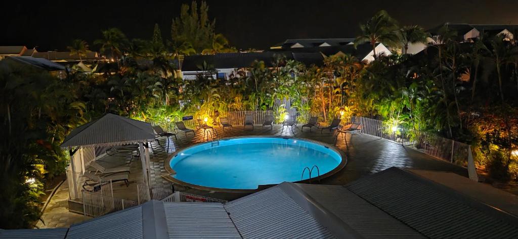 an overhead view of a swimming pool at night at Côté Golf Marina in Saint-François