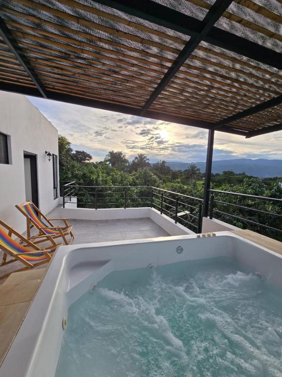 a jacuzzi tub on the balcony of a house at El Ensueño - Rest House in La Mesa