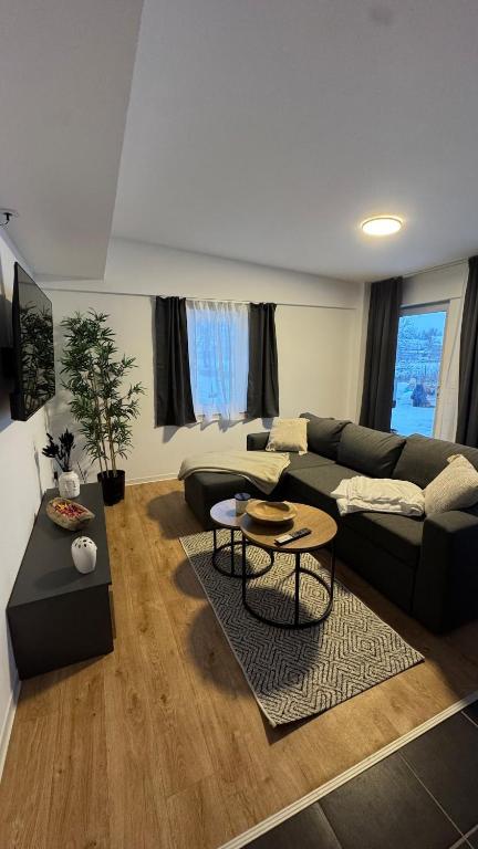 a living room with a couch and a table at SchrauberStube Bertkow in Goldbeck