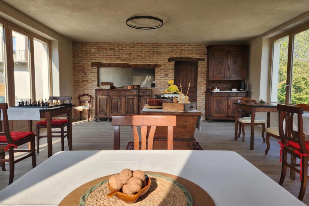 a kitchen with a table with a bowl of mushrooms at Monforte Country House in Monforte dʼAlba