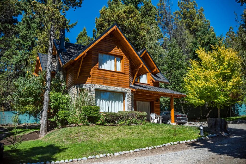 a log cabin in the woods at Bosque Dormido Cabañas & Spa in San Carlos de Bariloche