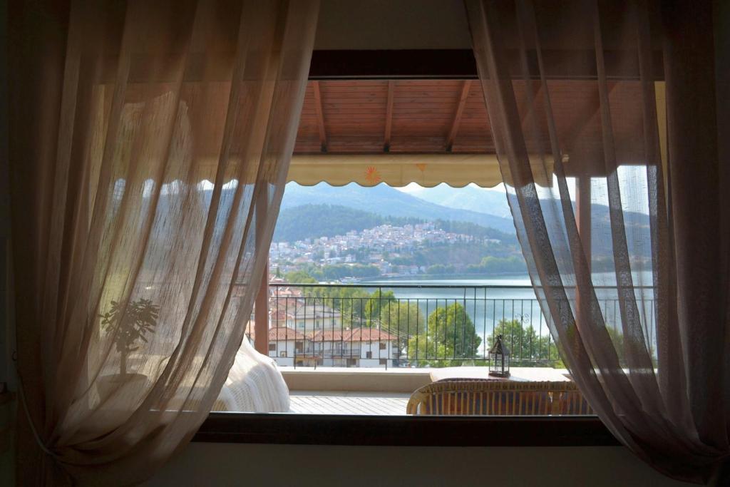 a window with a view of a mountain at Lakeview Balcony in Kastoria in Kastoria