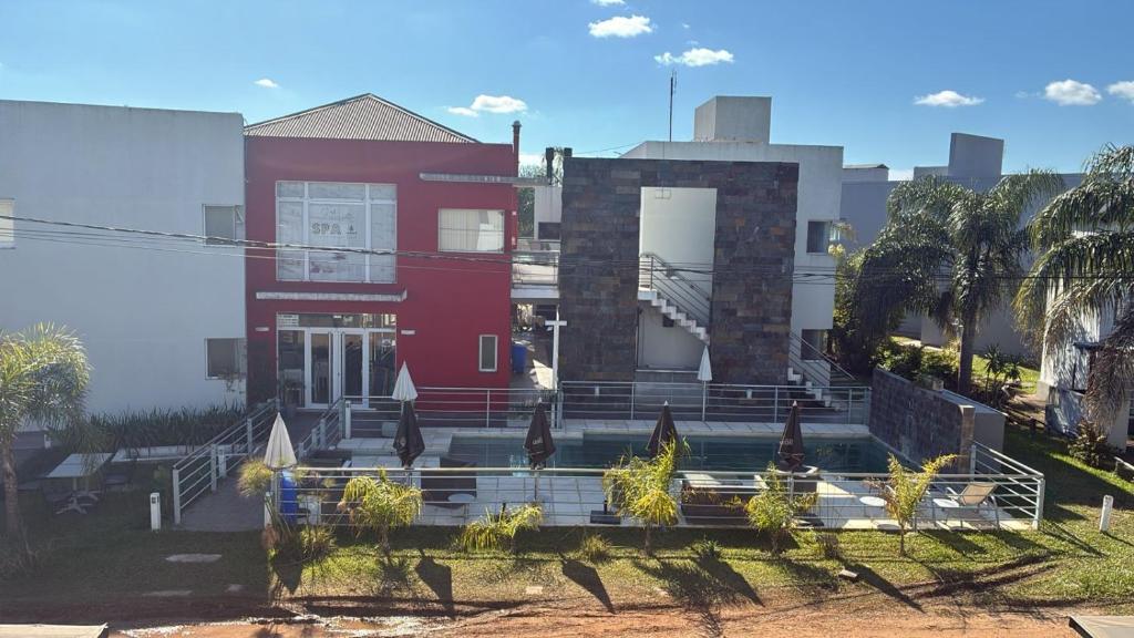 a red building with stairs in front of it at DINASTIE PALACE in Chajarí