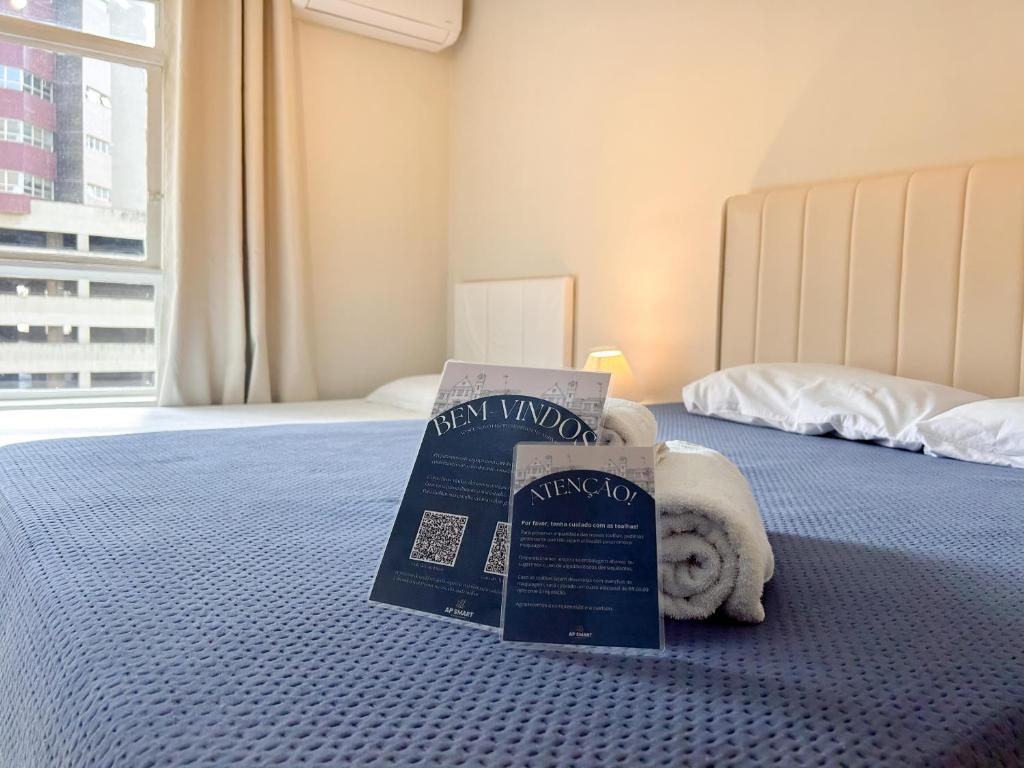 a hotel room with a box on a bed at AP Smart Center in Campinas