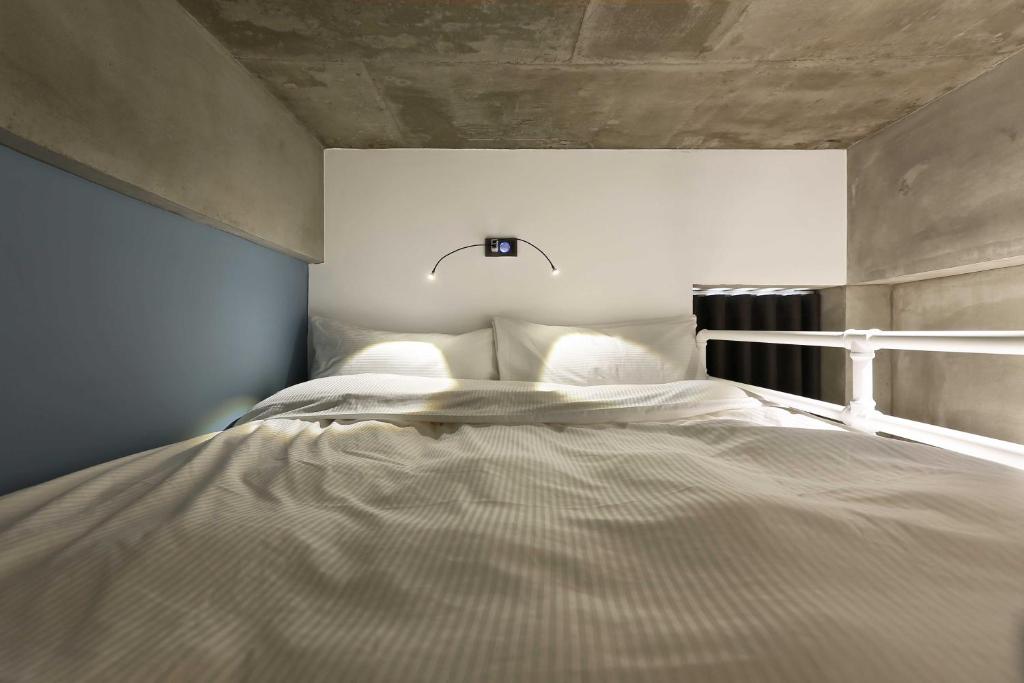 MINI HOTELS(逢甲館)客房内的一张或多张床位