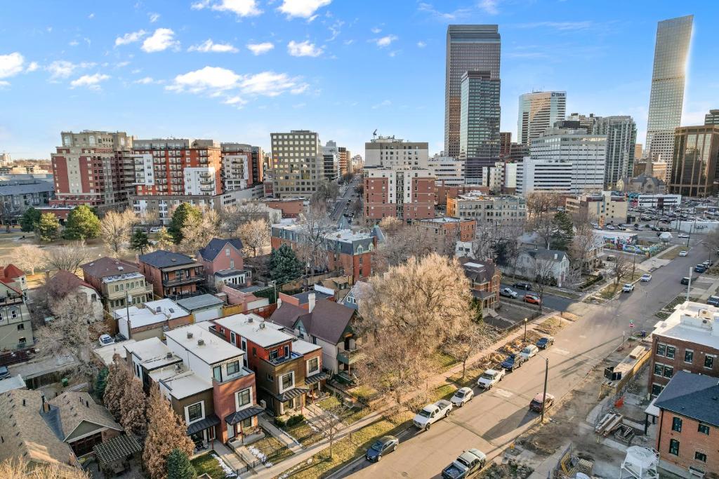 an aerial view of a city with tall buildings at Rooftop Retreat with Workspace and BBQ in Denver