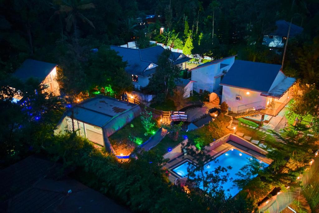 an aerial view of a house at night at Maryland Nature Stay Wayanad by VOYE HOMES in Wayanad